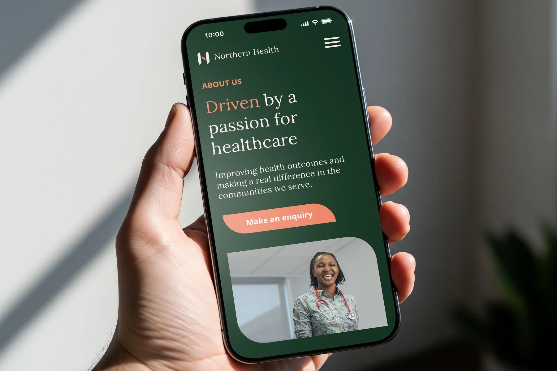 Northern Health website design mobile about page in hand